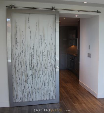 modern 3Form laminate barn door with stainless steel hardware