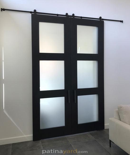 black shaker double barn doors with frosted glass panels