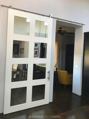 Painted White barn door with mirrors shaker style door with mirror panes