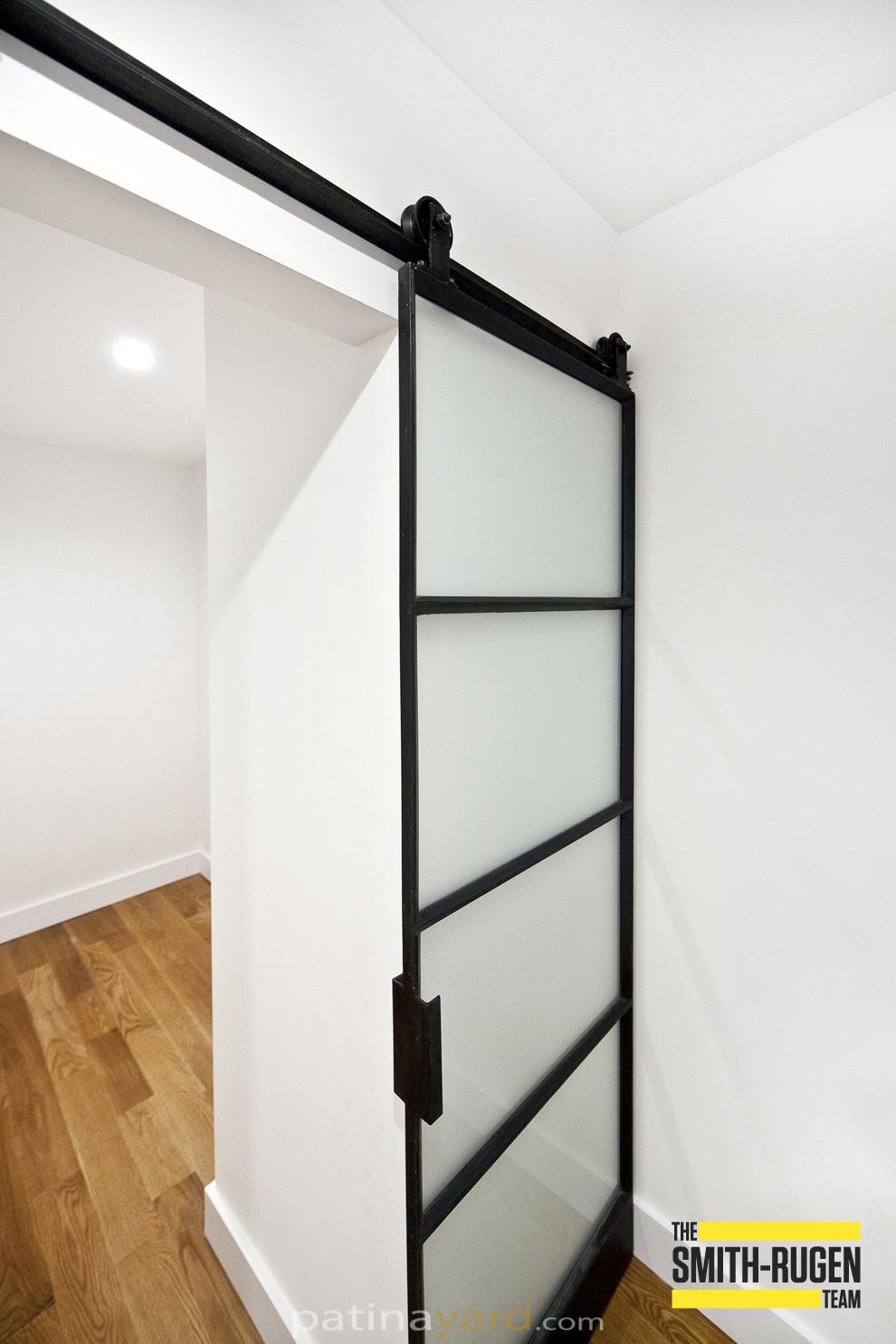 warehouse style door with opaque glass and bottom toe kick