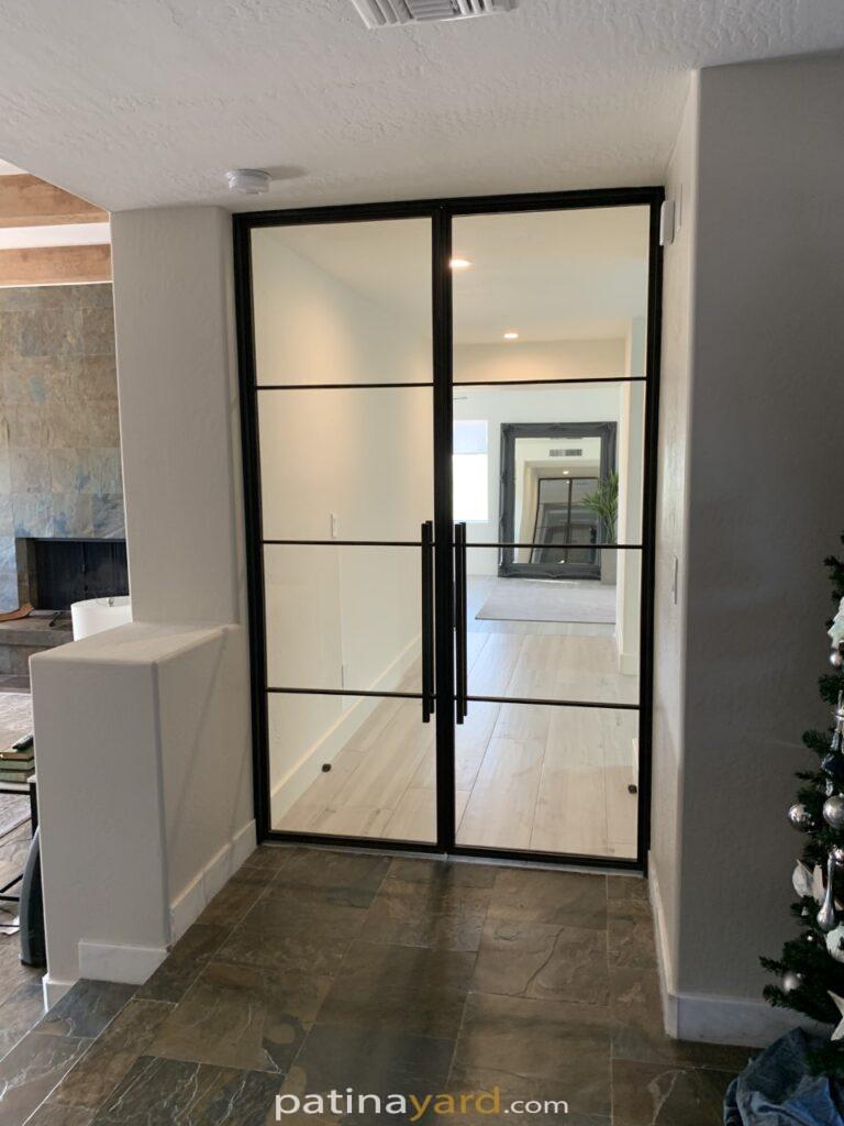 custom contemporary hinged metal and clear glass double doors