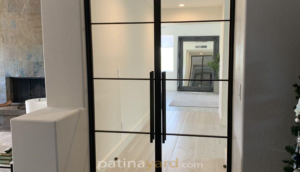 custom contemporary hinged metal and clear glass double doors