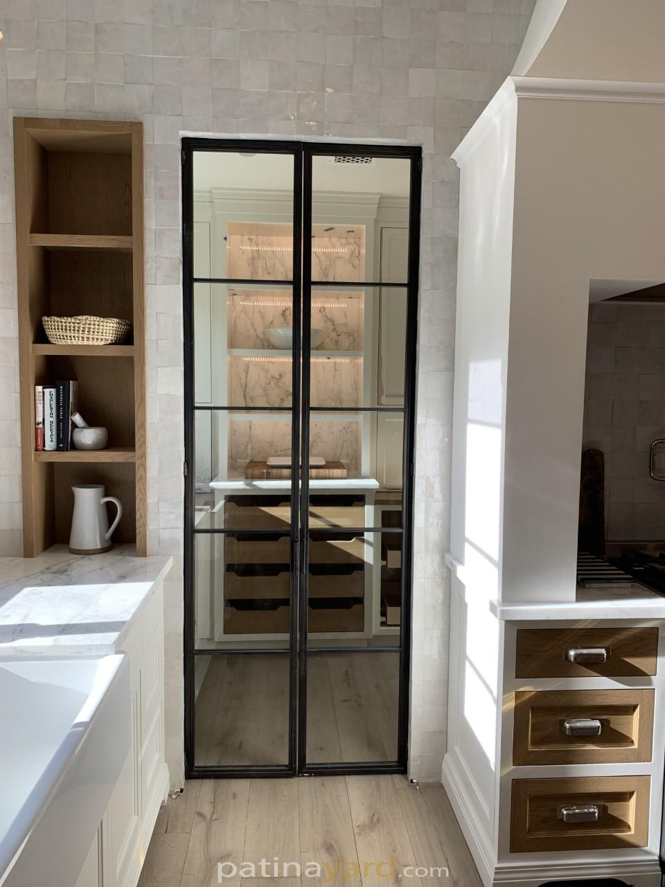 hinged double metal and glass doors