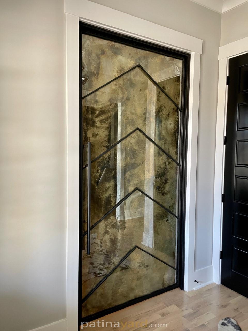 chevron pattern metal and antique mirror door
