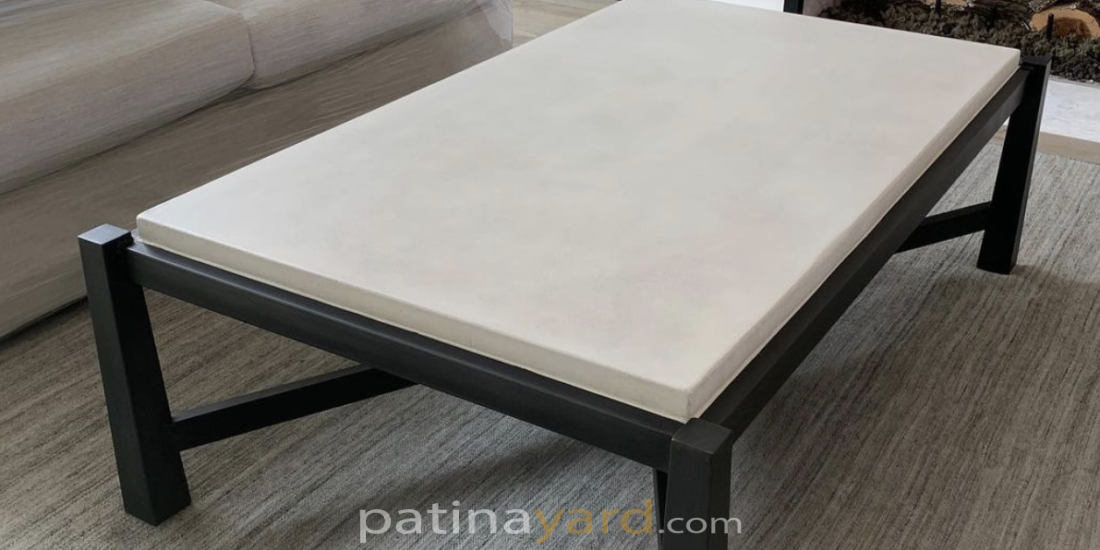 white concrete and black metal coffee table