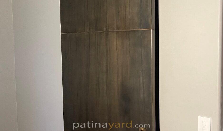 metal panel door with brass handle