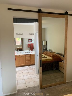 wood and mirror barn door and track