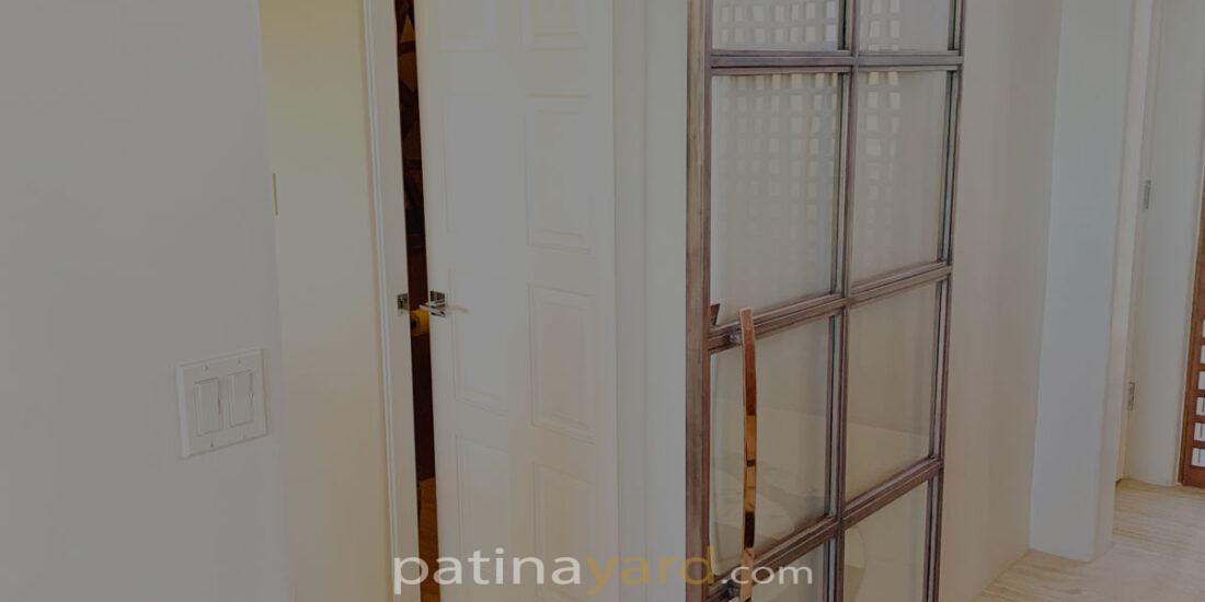 custom copper barn door and glass