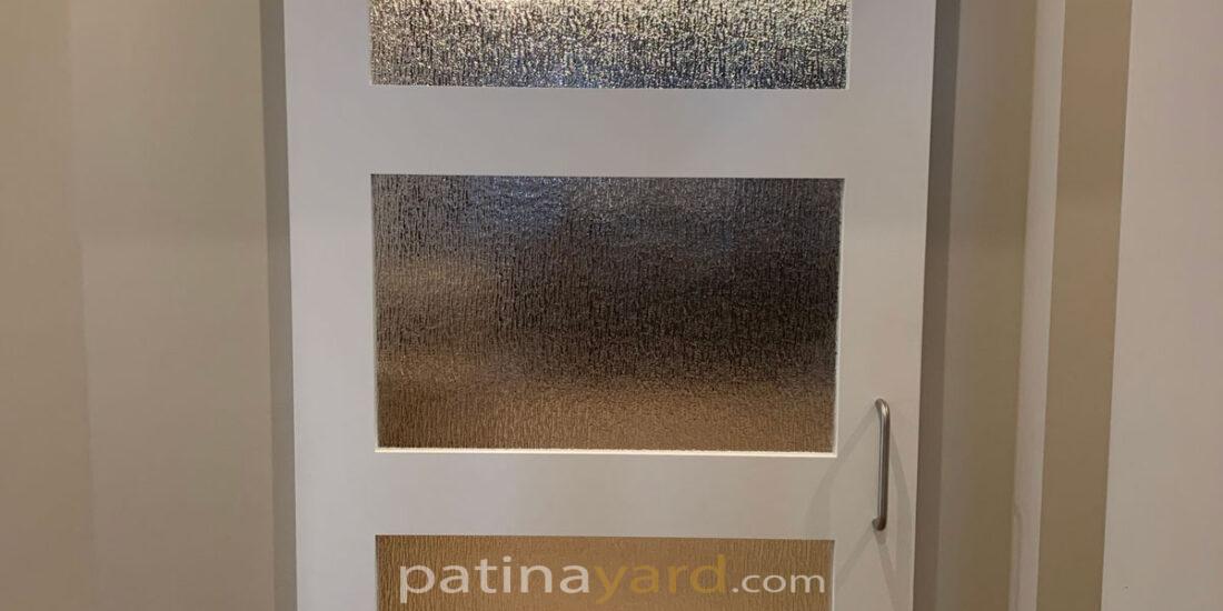 painted white shaker barn door with stainless steel hadware