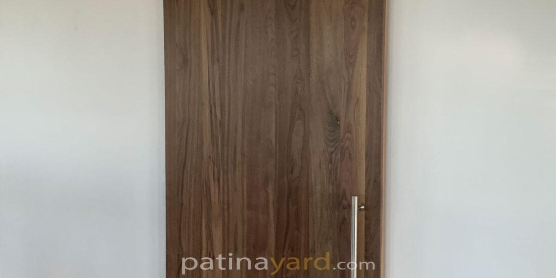 walnut barn door with stainless steel hardware