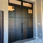 Custom Patina Steel Doors with Transom and Fixed Panels