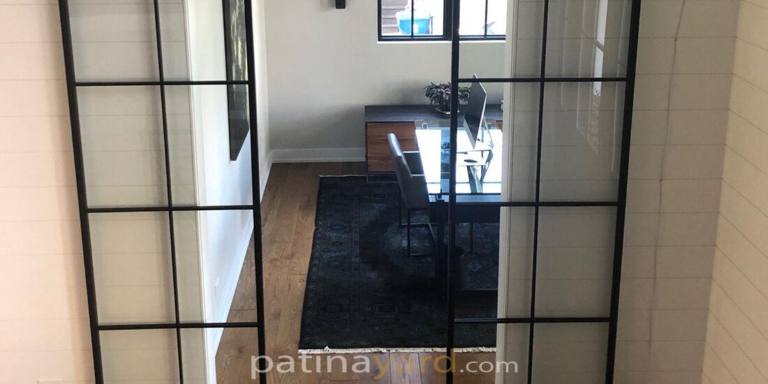 Contemporary metal and glass barn doors with thin metal frame