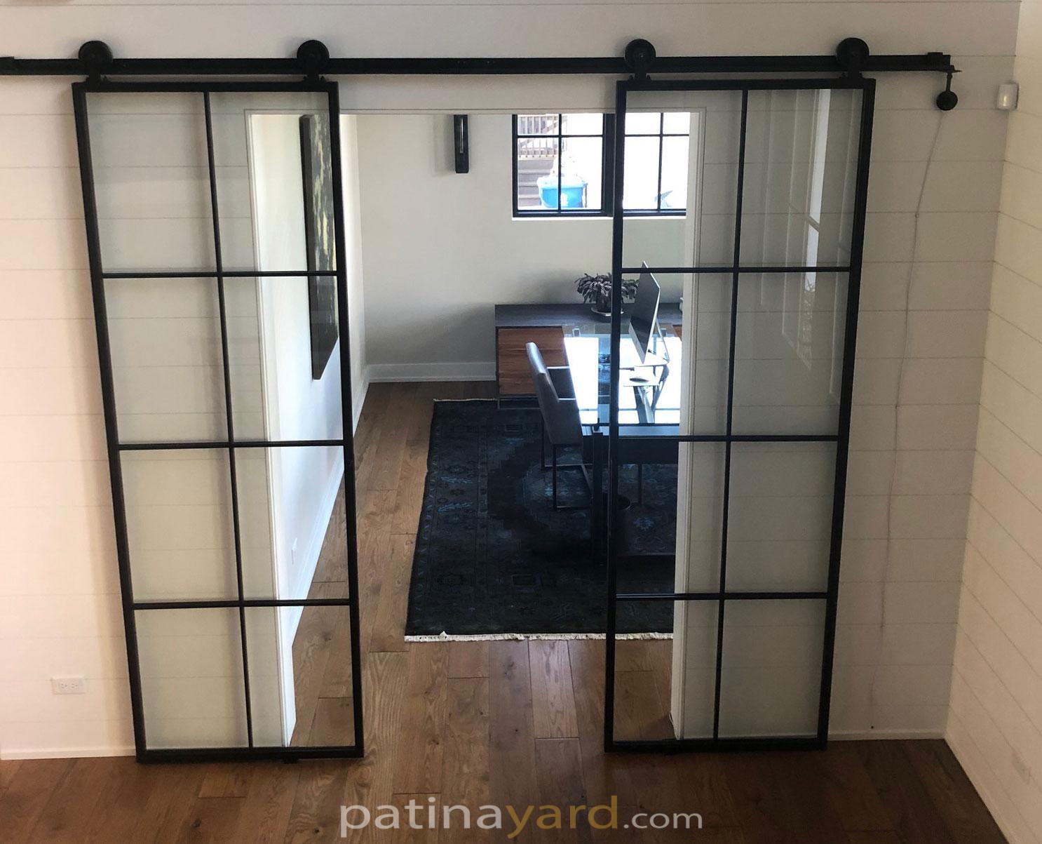 Contemporary metal and glass barn doors with thin metal frame