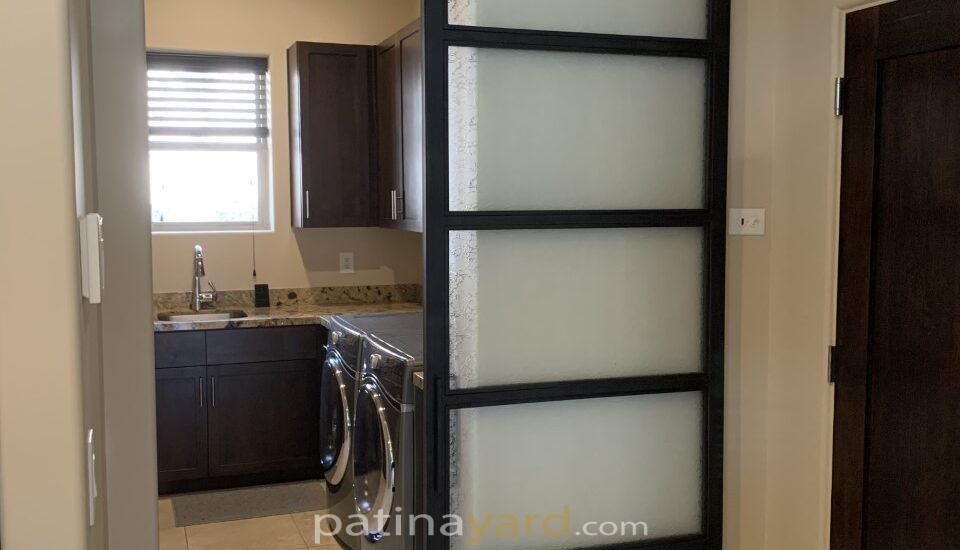 laundry room frosted glass and blacken metal barn door