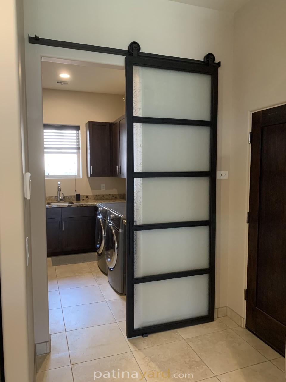 laundry room frosted glass and blacken metal barn door