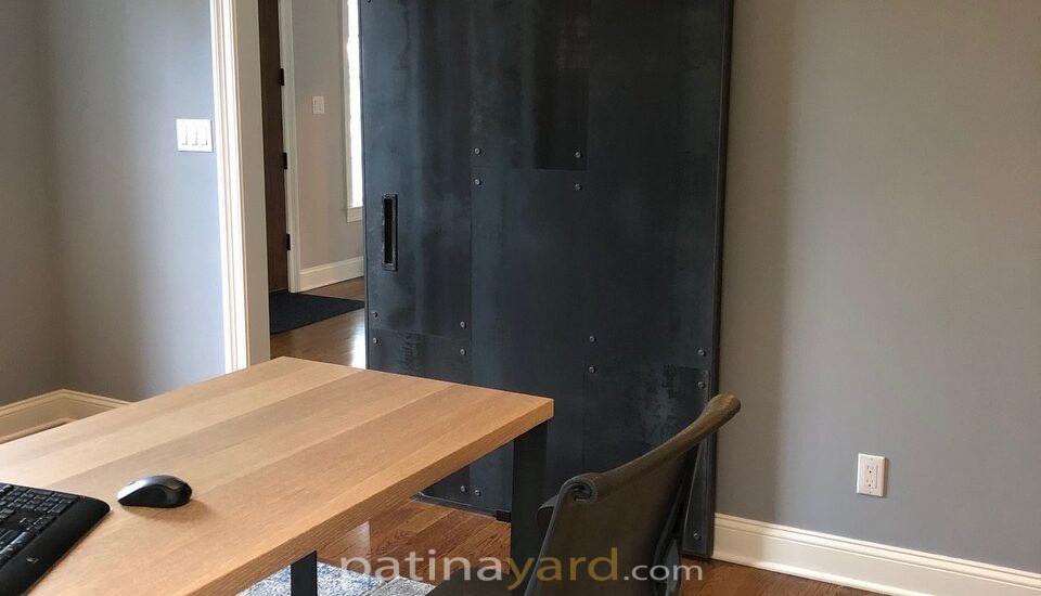 Hot rolled steel door with rivets
