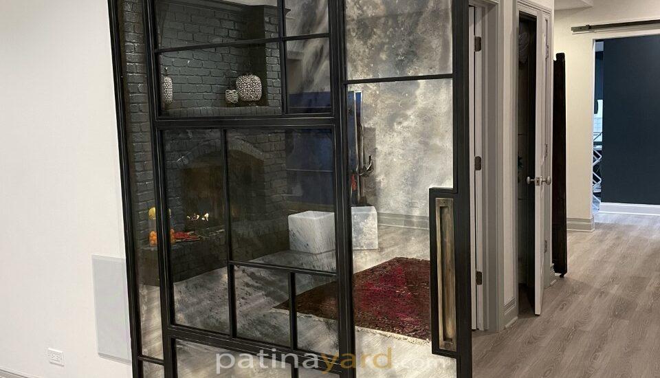 custom antique mirror barn door with random patterns and metal frame