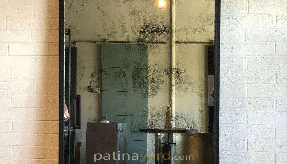 antique mirror with blackened frame
