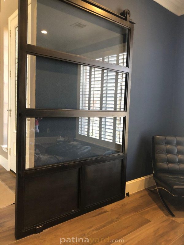 black steel and clear glass barn door