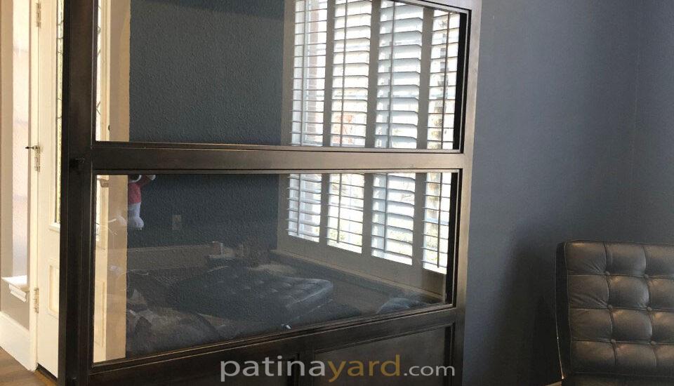 black steel and clear glass barn door
