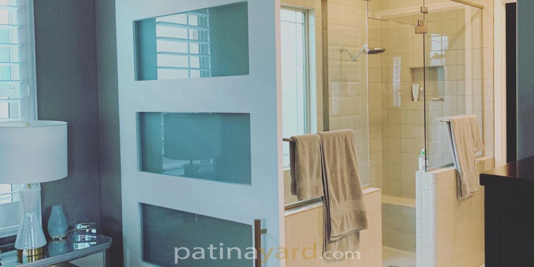 master bedroom painted wood barn door with satin glass