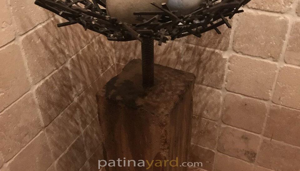 egg and metal nest art piece