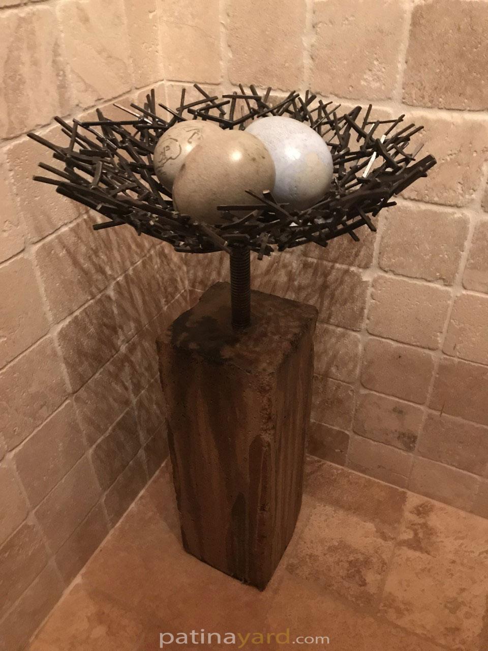 egg and metal nest art piece
