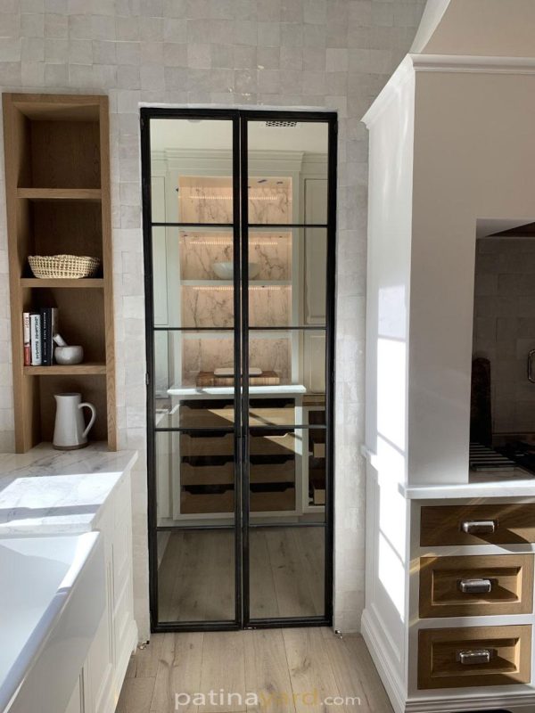 Contemporary black metal and clear glass double pantry doors