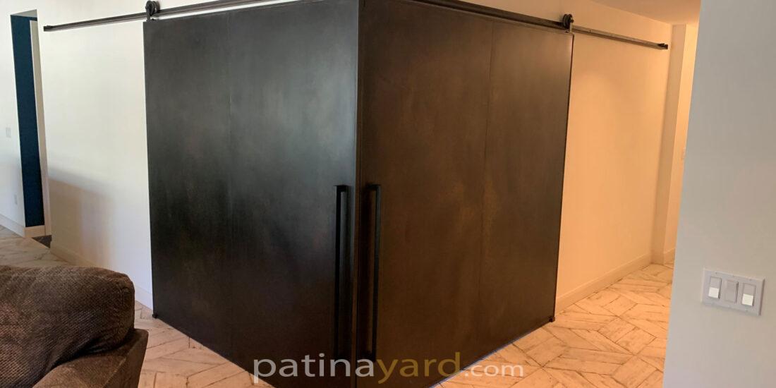 Patina steel doors in a corner