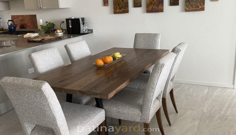 contemporary walnut dining table with metal tapered legs