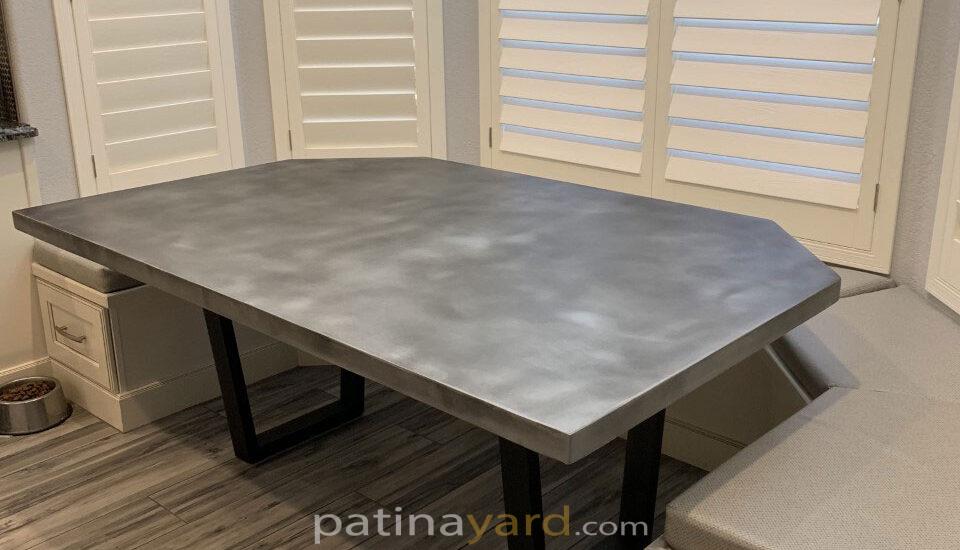 zinc table with u shaped metal legs