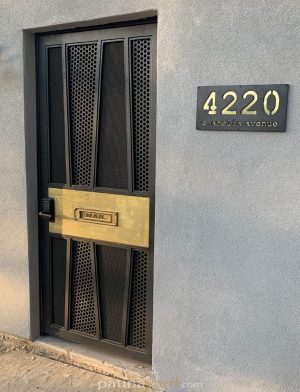 custom metal gate with brass inset