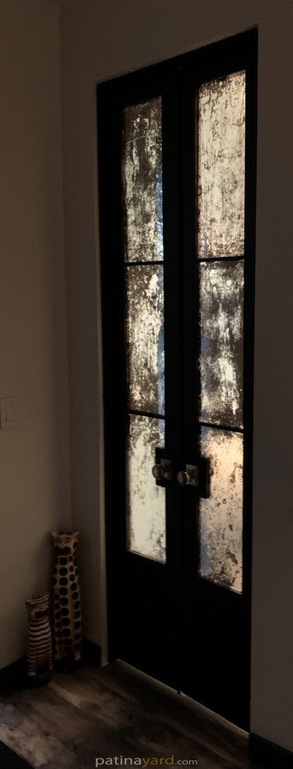 small double doors with antique mirrors
