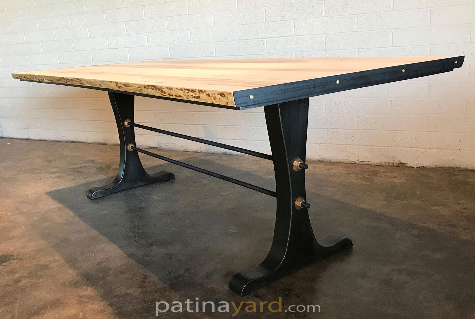 Industrial table with cast iron style French legs and live edge wood top