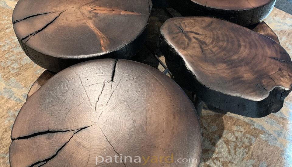 stained and charred log coffee table