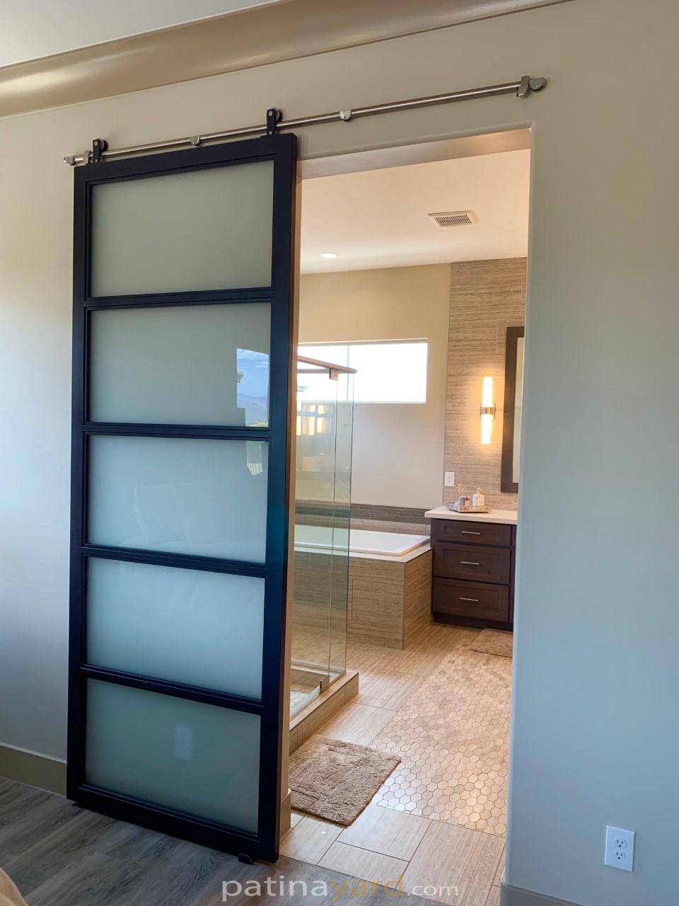 contemporary frosted glass and metal black barn door