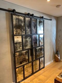 contemporary industrial double doors with random antique mirrors