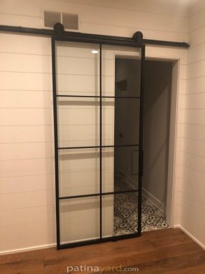 Single Metal and Glass Barn Door Metal and glass barn door