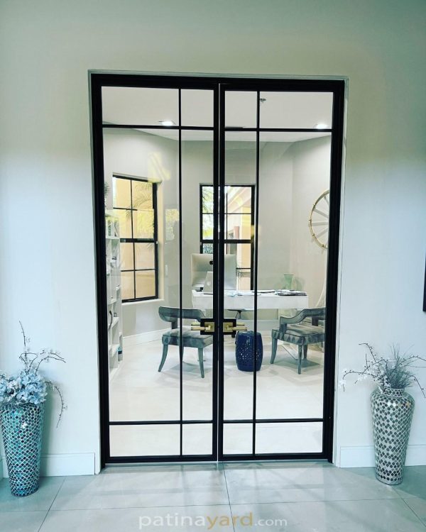 Contemporary modern metal and glass hinged doors with a grid of glass panes