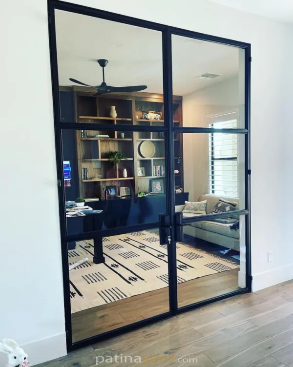 Custom hinged contemporary steel and glass doors opening to a home office