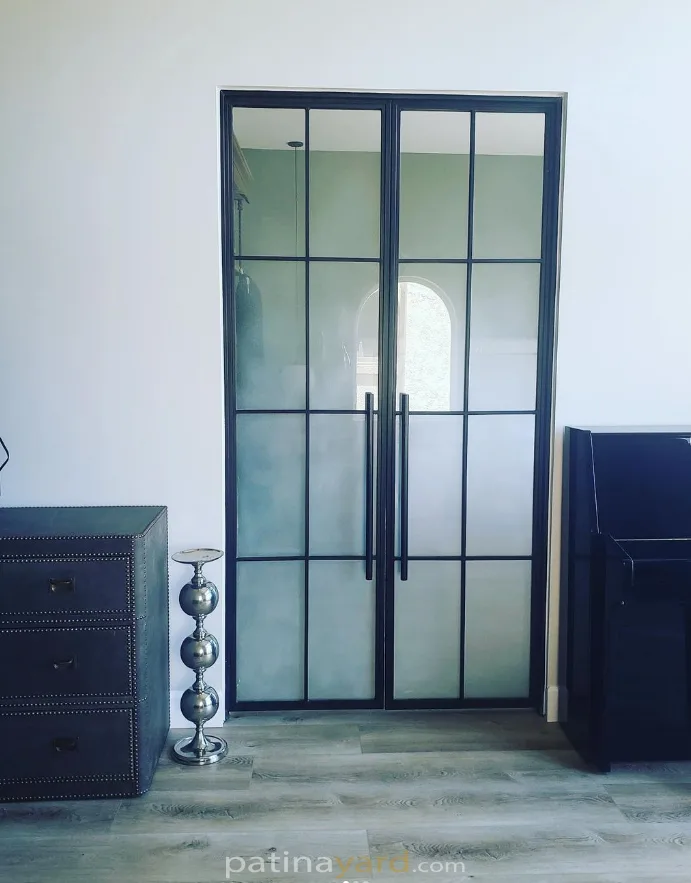 Black metal and sandblasted glass hinged double doors