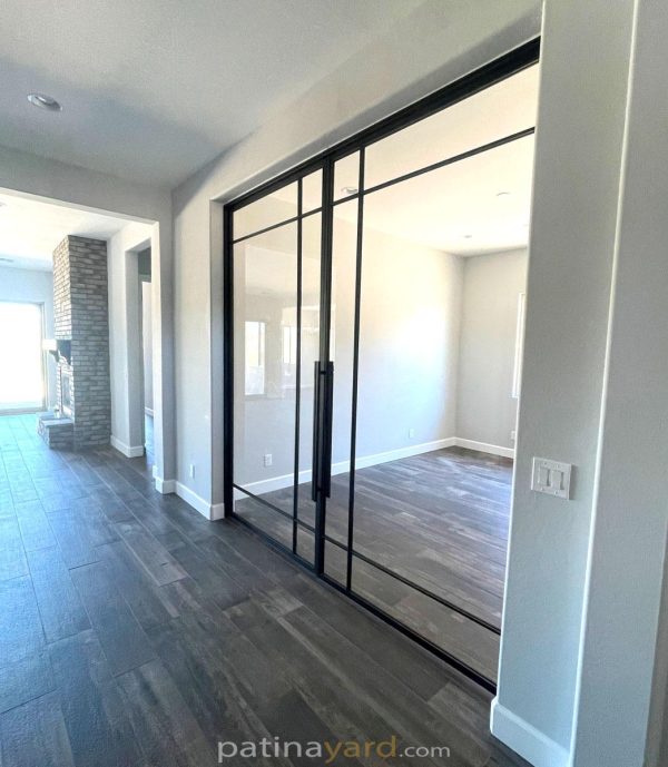 Large black metal and glass hinged double office doors