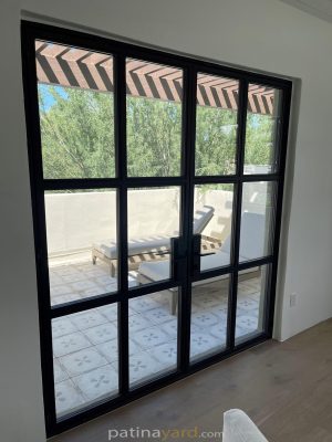 Exterior steel and glass doors with a grid of glass panes