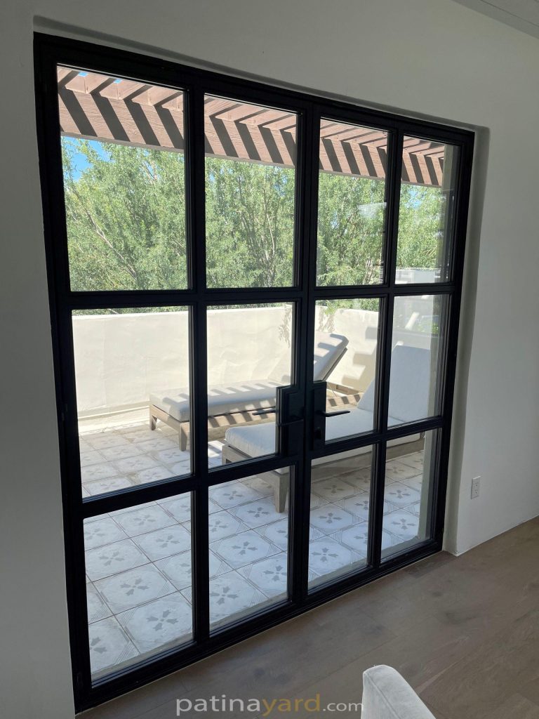 Exterior steel and glass doors with a grid of glass panes
