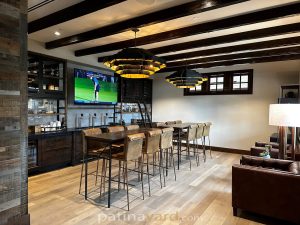 Wine and alcohol metal and glass cabinets with wood shelves home bar area