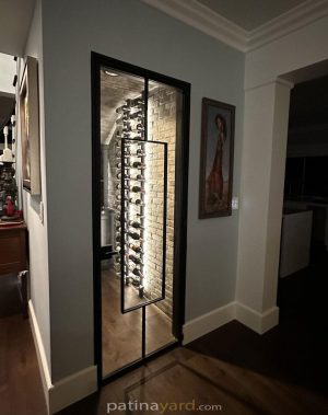 Wine cellar steel and glass door with a long vertical pull