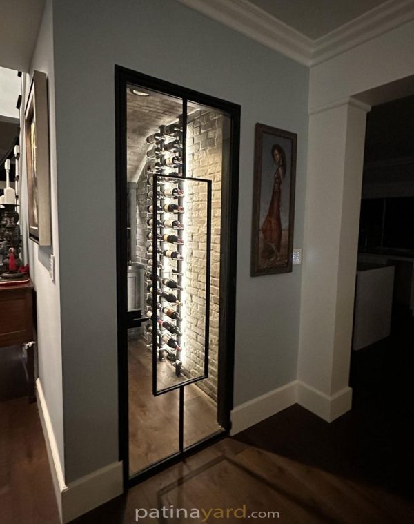 Wine cellar steel and glass door with a long vertical pull