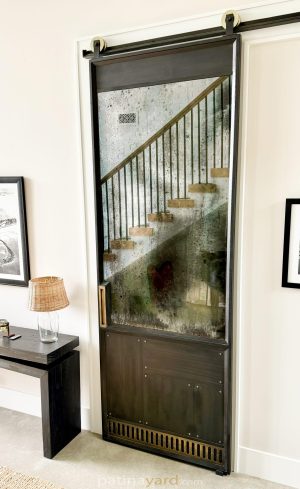 Metal and antique barn door Metal and antique mirror barn door with a diagonal metal design