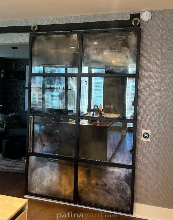 8 panel antique barn door Eight panel antique mirror barn door with a black steel frame