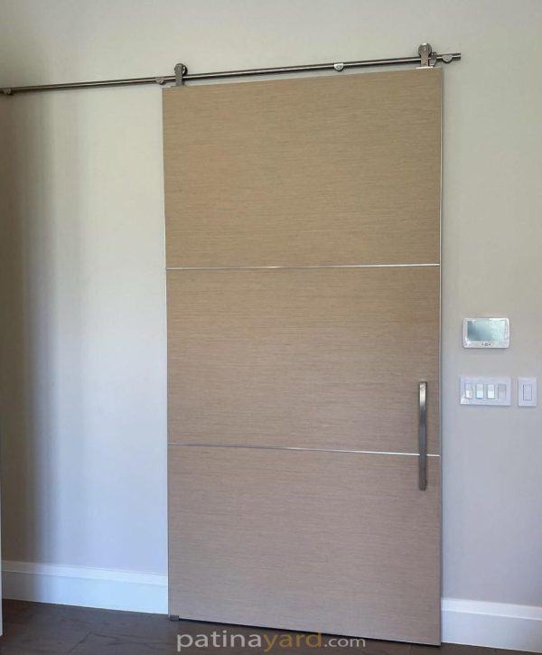 Bella barn door Clean laminate barn door with stainless steel hardware and stainless steel in the seams